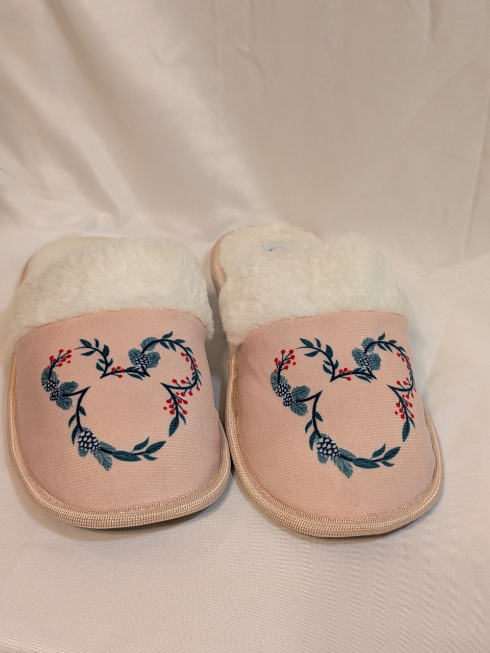Disney Pink Slip-On Women's Slippers with Blue Floral Mickey Mouse Silhouette.